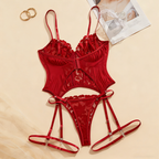Red lace lingerie set with straps on a beige background