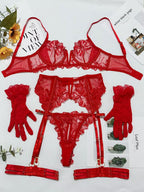 Red lingerie set with garter belt on a white background