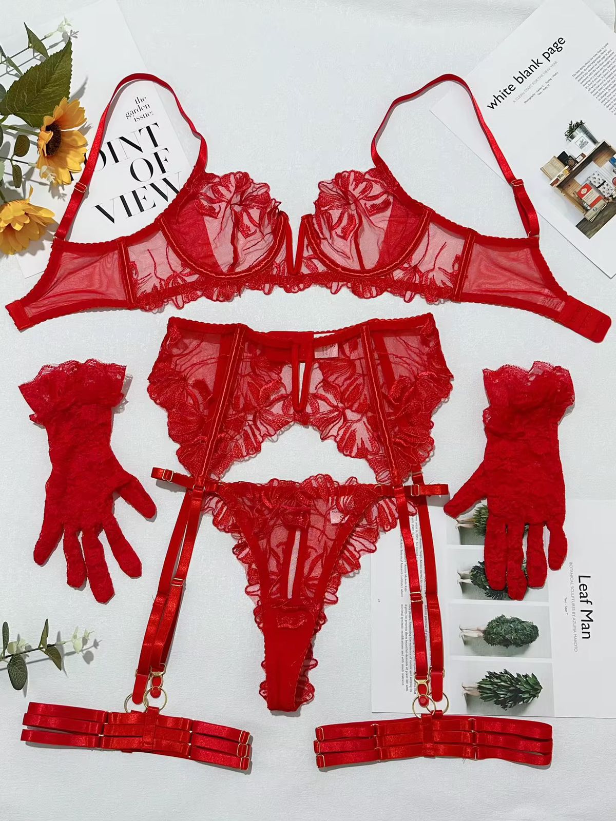 Red lingerie set with garter belt on a white background