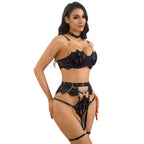 Woman wearing a black lace lingerie set on a white background